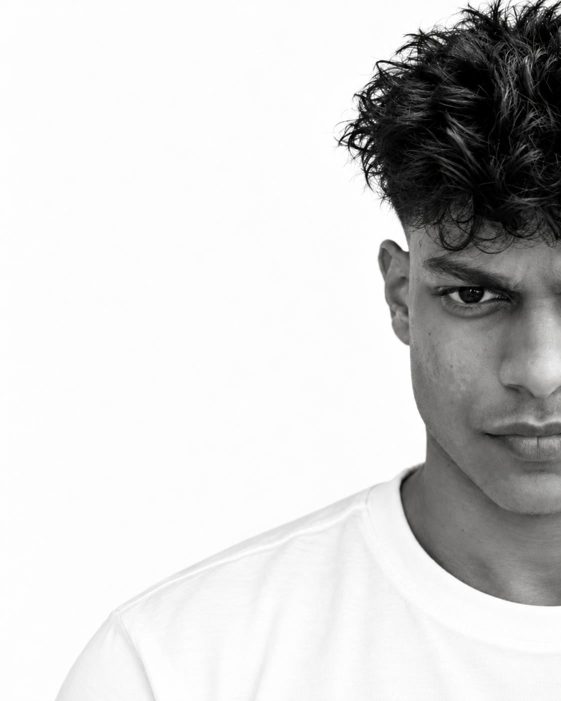 Black and white half-face portrait of Jonathan D’Costa